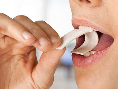 Woman about to chew gum