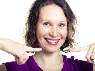 Smiling with confidence, woman with braces