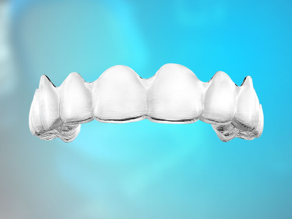 Clear aligners in bright blue background